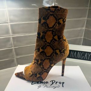 Brand new snake skin boots with approx 3/4 inch heel.